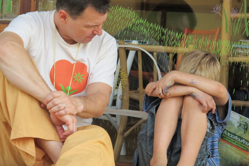 Michel, Panyaden Head Teacher, spending time with a student