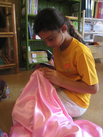 img_7843 Student patiently sewing her dress, Panyaden School Chiang Mai