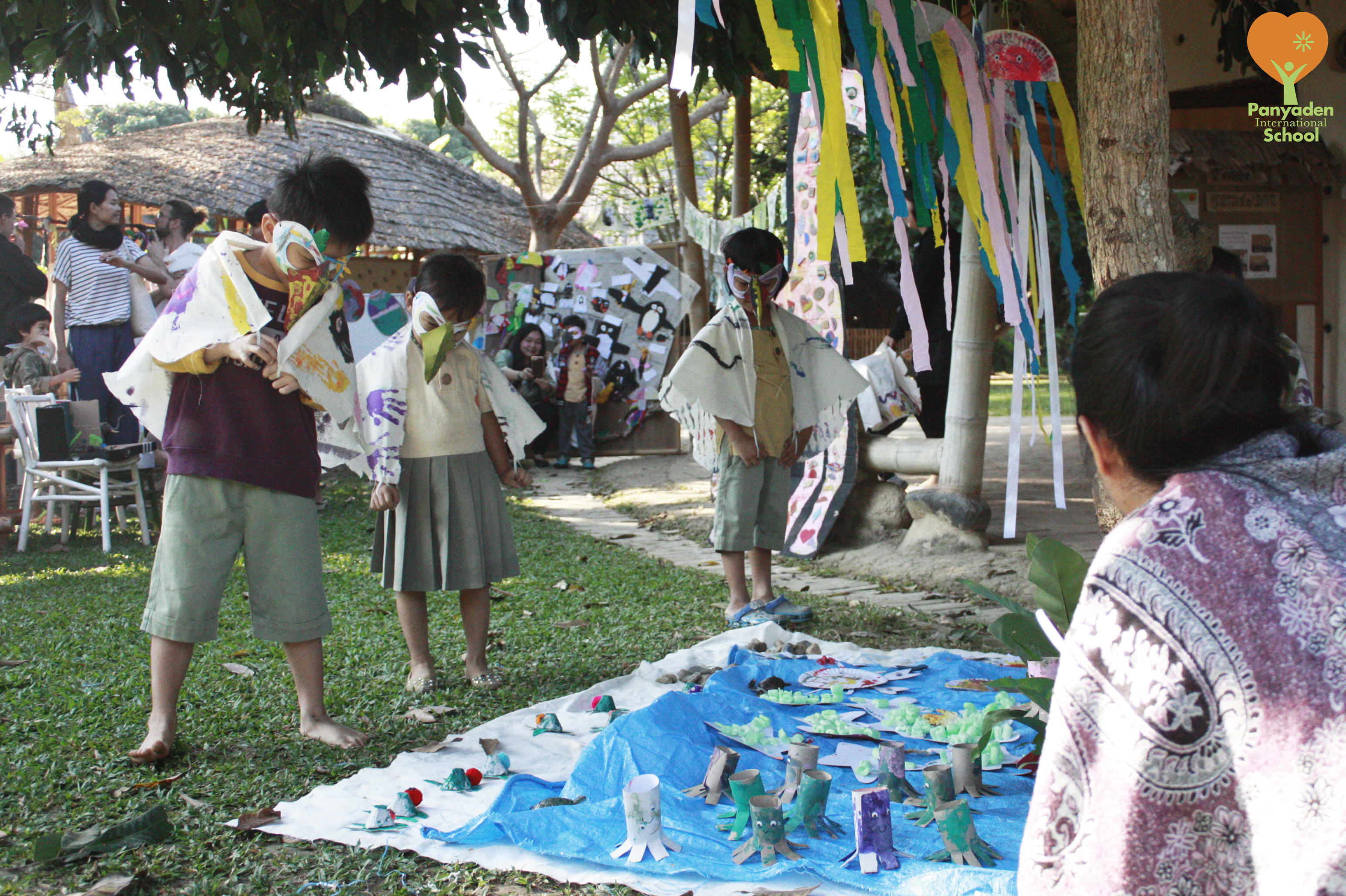 Panyaden pre-schoolers in bird costumes admiring an animal art art exhibition