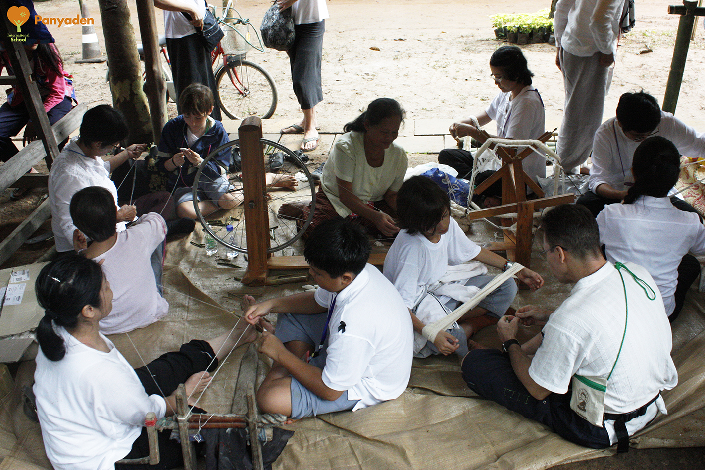 Preparing cotton threads for weaving, Panyaden at Jula Khatina in CHiang Rai