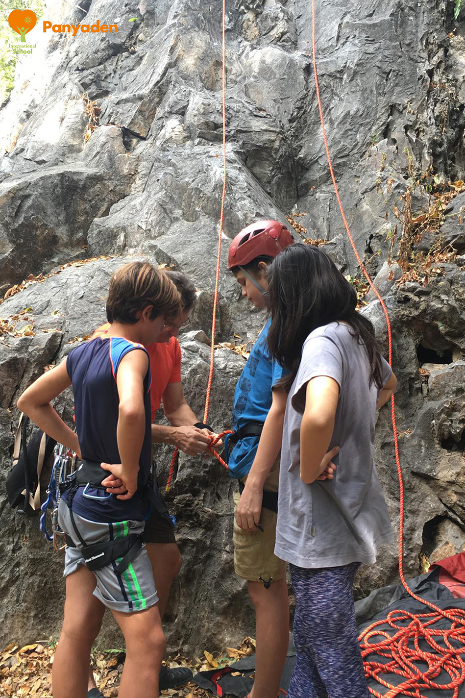 Panyaden Y7 rock climbing - head teacher showing students the ropes